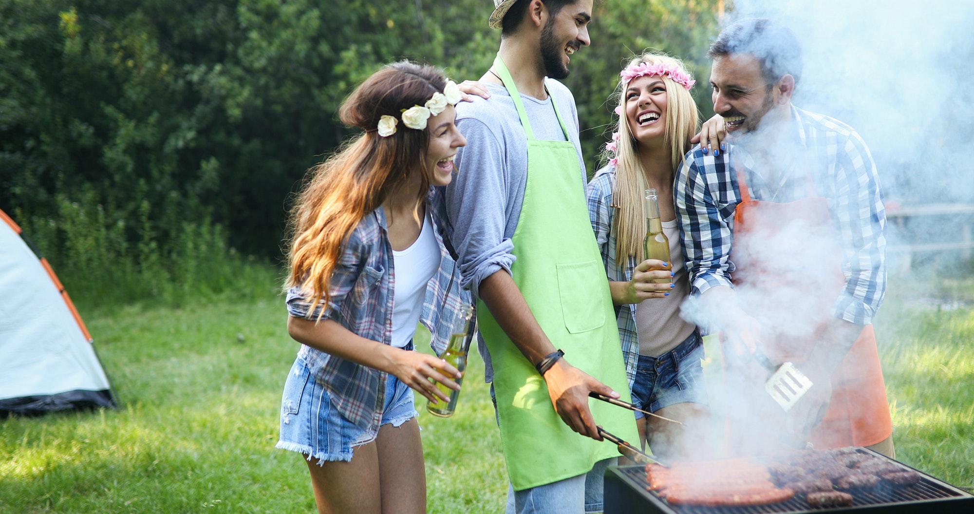 group of friends having outdoor garden barbecue